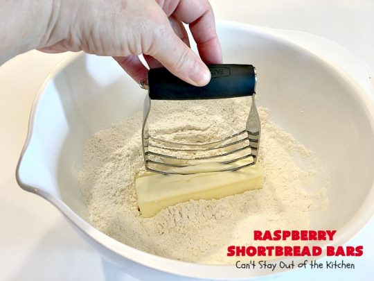 Raspberry Shortbread Bars | Can't Stay Out of the Kitchen | these #cookie type bars are absolutely divine! They have a shortbread crust, topped with #raspberry preserves & a #coconut topping. You'll be drooling over every bite! #dessert