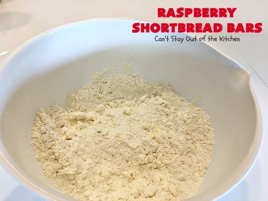 Raspberry Shortbread Bars | Can't Stay Out of the Kitchen | these #cookie type bars are absolutely divine! They have a shortbread crust, topped with #raspberry preserves & a #coconut topping. You'll be drooling over every bite! #dessert