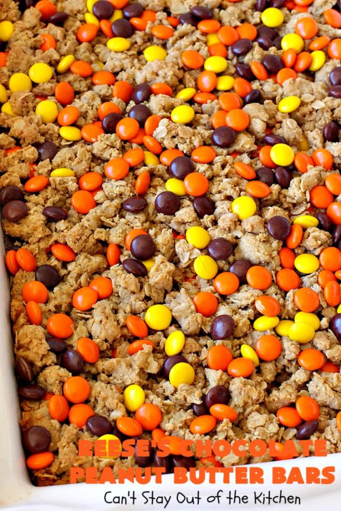 Reese's Chocolate Peanut Butter Bars | Can't Stay Out of the Kitchen | these outrageous #cookies start with an #OatmealCookie & #PeanutButter crust & topping. They have a #chocolate sauce & #ReesesPeanutButterCandies in the middle. Absolutely awesome! #tailgating #brownie #dessert #ChocolateDessert #PeanutButterDessert #ReesesPeanutButterDessert #ReesesChocolatePeanutButterBars