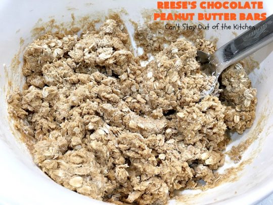 Reese's Chocolate Peanut Butter Bars | Can't Stay Out of the Kitchen | these outrageous #cookies start with an #OatmealCookie & #PeanutButter crust & topping. They have a #chocolate sauce & #ReesesPeanutButterCandies in the middle. Absolutely awesome! #tailgating #brownie #dessert #ChocolateDessert #PeanutButterDessert #ReesesPeanutButterDessert #ReesesChocolatePeanutButterBars