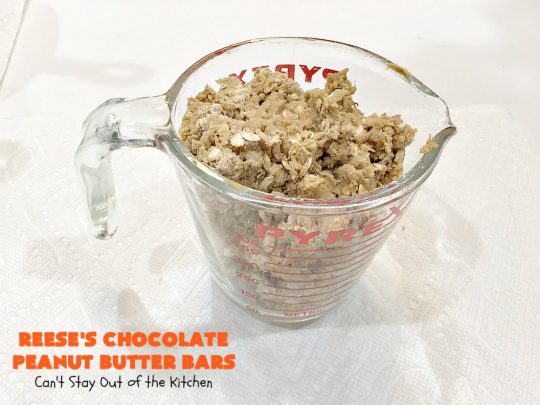 Reese's Chocolate Peanut Butter Bars | Can't Stay Out of the Kitchen | these outrageous #cookies start with an #OatmealCookie & #PeanutButter crust & topping. They have a #chocolate sauce & #ReesesPeanutButterCandies in the middle. Absolutely awesome! #tailgating #brownie #dessert #ChocolateDessert #PeanutButterDessert #ReesesPeanutButterDessert #ReesesChocolatePeanutButterBars
