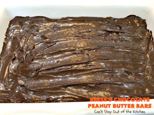 Reese's Chocolate Peanut Butter Bars | Can't Stay Out of the Kitchen | these outrageous #cookies start with an #OatmealCookie & #PeanutButter crust & topping. They have a #chocolate sauce & #ReesesPeanutButterCandies in the middle. Absolutely awesome! #tailgating #brownie #dessert #ChocolateDessert #PeanutButterDessert #ReesesPeanutButterDessert #ReesesChocolatePeanutButterBars