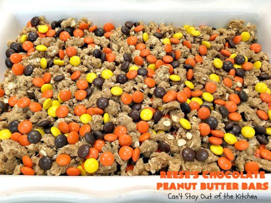 Reese's Chocolate Peanut Butter Bars | Can't Stay Out of the Kitchen | these outrageous #cookies start with an #OatmealCookie & #PeanutButter crust & topping. They have a #chocolate sauce & #ReesesPeanutButterCandies in the middle. Absolutely awesome! #tailgating #brownie #dessert #ChocolateDessert #PeanutButterDessert #ReesesPeanutButterDessert #ReesesChocolatePeanutButterBars