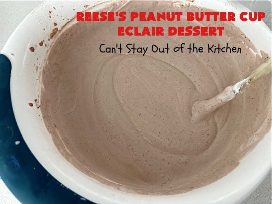 Reese's Peanut Butter Cup Éclair Dessert | Can't Stay Out of the Kitchen | Everyone swooned over this delightful #ÉclairDessert when I brought it for a #Christmas party. This easy 6-ingredient #recipe is so easy a child can make it. Plus, it's just so outrageously good everyone will want to sample it. Great for #ValentinesDay, special occasions & birthdays! #Reeses #ReesesPeanutButterCups #chocolate #PeanutButter #GrahamCrackers #Éclairs #6IngredientRecipe #ReesesPeanutButterCupÉclairDessert