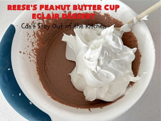 Reese's Peanut Butter Cup Éclair Dessert | Can't Stay Out of the Kitchen | Everyone swooned over this delightful #ÉclairDessert when I brought it for a #Christmas party. This easy 6-ingredient #recipe is so easy a child can make it. Plus, it's just so outrageously good everyone will want to sample it. Great for #ValentinesDay, special occasions & birthdays! #Reeses #ReesesPeanutButterCups #chocolate #PeanutButter #GrahamCrackers #Éclairs #6IngredientRecipe #ReesesPeanutButterCupÉclairDessert