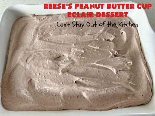 Reese's Peanut Butter Cup Éclair Dessert | Can't Stay Out of the Kitchen | Everyone swooned over this delightful #ÉclairDessert when I brought it for a #Christmas party. This easy 6-ingredient #recipe is so easy a child can make it. Plus, it's just so outrageously good everyone will want to sample it. Great for #ValentinesDay, special occasions & birthdays! #Reeses #ReesesPeanutButterCups #chocolate #PeanutButter #GrahamCrackers #Éclairs #6IngredientRecipe #ReesesPeanutButterCupÉclairDessert