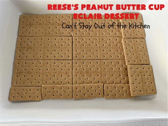 Reese's Peanut Butter Cup Éclair Dessert | Can't Stay Out of the Kitchen | Everyone swooned over this delightful #ÉclairDessert when I brought it for a #Christmas party. This easy 6-ingredient #recipe is so easy a child can make it. Plus, it's just so outrageously good everyone will want to sample it. Great for #ValentinesDay, special occasions & birthdays! #Reeses #ReesesPeanutButterCups #chocolate #PeanutButter #GrahamCrackers #Éclairs #6IngredientRecipe #ReesesPeanutButterCupÉclairDessert