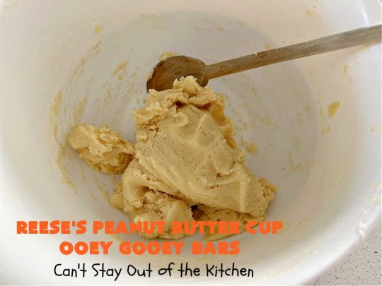Reese's Peanut Butter Cup Ooey Gooey Bars | Can't Stay Out of the Kitchen | This fabulous #OoeyGooeyBar #recipe uses only 6 ingredients! It has a luscious #cheesecake filling & it's topped with #ReesesPeanutButterCups. Every bite will have you swooning! Great for #holiday #baking, #tailgating parties, a #ChristmasCookieExchange or any time you just need #chocolate! #PeanutButter #dessert #brownie #cookie #CreamCheese #ReesesPeanutButterCupOoeyGooeyBars