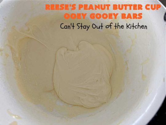 Reese's Peanut Butter Cup Ooey Gooey Bars | Can't Stay Out of the Kitchen | This fabulous #OoeyGooeyBar #recipe uses only 6 ingredients! It has a luscious #cheesecake filling & it's topped with #ReesesPeanutButterCups. Every bite will have you swooning! Great for #holiday #baking, #tailgating parties, a #ChristmasCookieExchange or any time you just need #chocolate! #PeanutButter #dessert #brownie #cookie #CreamCheese #ReesesPeanutButterCupOoeyGooeyBars