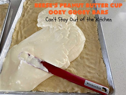 Reese's Peanut Butter Cup Ooey Gooey Bars | Can't Stay Out of the Kitchen | This fabulous #OoeyGooeyBar #recipe uses only 6 ingredients! It has a luscious #cheesecake filling & it's topped with #ReesesPeanutButterCups. Every bite will have you swooning! Great for #holiday #baking, #tailgating parties, a #ChristmasCookieExchange or any time you just need #chocolate! #PeanutButter #dessert #brownie #cookie #CreamCheese #ReesesPeanutButterCupOoeyGooeyBars