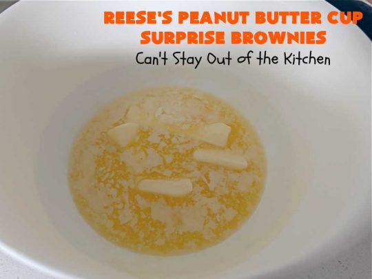 Reese's Peanut Butter Cup Surprise Brownies | Can't Stay Out of the Kitchen | These delectable #brownies have a wonderful "surprise" in each bite. A #ReesesPeanutButterCup is buried in each one. This fantastic over-the-top #dessert will have you swooning. Great for #tailgating parties, the #SuperBowl, #MarchMadness & other sporting events. #chocolate #PeanutButter #ReesesPeanutButterCupSurpriseBrownies
