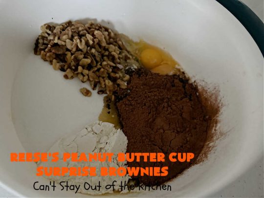 Reese's Peanut Butter Cup Surprise Brownies | Can't Stay Out of the Kitchen | These delectable #brownies have a wonderful "surprise" in each bite. A #ReesesPeanutButterCup is buried in each one. This fantastic over-the-top #dessert will have you swooning. Great for #tailgating parties, the #SuperBowl, #MarchMadness & other sporting events. #chocolate #PeanutButter #ReesesPeanutButterCupSurpriseBrownies