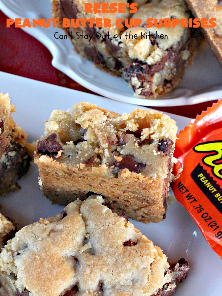 Reese's Peanut Butter Cup Surprises | Can't Stay Out of the Kitchen | these awesome #brownies have #ReesesPeanutButterCups tucked away between two layers of #MrsFieldsChocolateChipCookie dough. They are rich, decadent & absolutely heavenly. Perfect for #tailgating parties, a company #dessert or a #ChristmasCookieExchange. #PeanutButter #PeanutButterCups #chocolate #ReesesPeanutButterCupSurprises