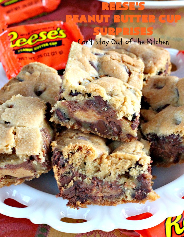 Reese's Peanut Butter Cup Surprises | Can't Stay Out of the Kitchen | these awesome #brownies have #ReesesPeanutButterCups tucked away between two layers of #MrsFieldsChocolateChipCookie dough. They are rich, decadent & absolutely heavenly. Perfect for #tailgating parties, a company #dessert or a #ChristmasCookieExchange. #PeanutButter #PeanutButterCups #chocolate #ReesesPeanutButterCupSurprises
