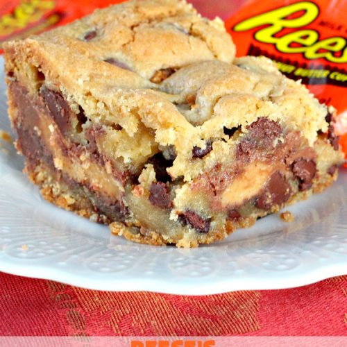 Reese's Peanut Butter Cup Surprises | Can't Stay Out of the Kitchen | these awesome #brownies have #ReesesPeanutButterCups tucked away between two layers of #MrsFieldsChocolateChipCookie dough. They are rich, decadent & absolutely heavenly. Perfect for #tailgating parties, a company #dessert or a #ChristmasCookieExchange. #PeanutButter #PeanutButterCups #chocolate #ReesesPeanutButterCupSurprises