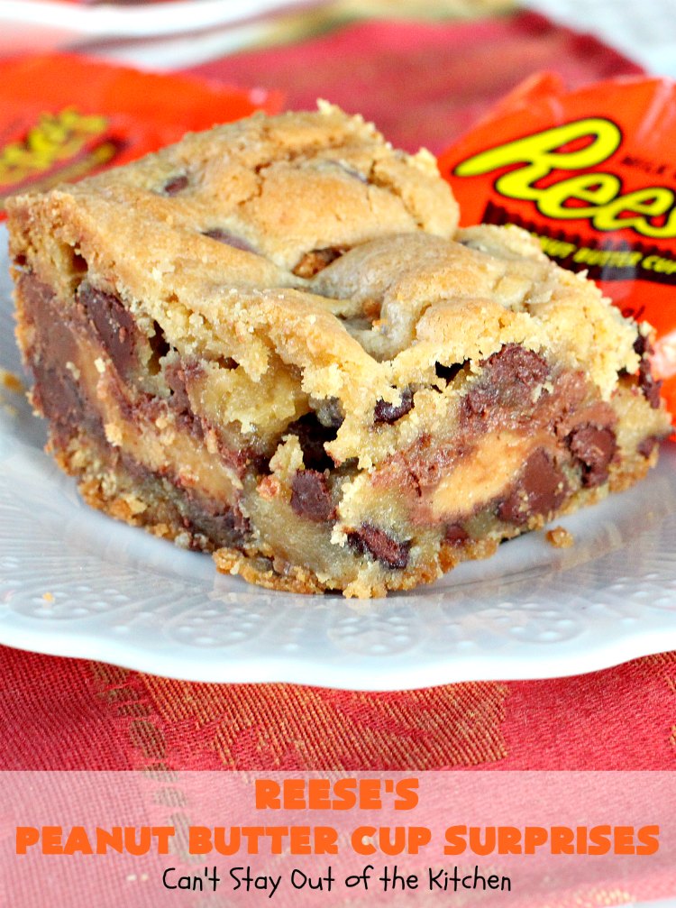 Reese's Peanut Butter Cup Surprises | Can't Stay Out of the Kitchen | these awesome #brownies have #ReesesPeanutButterCups tucked away between two layers of #MrsFieldsChocolateChipCookie dough. They are rich, decadent & absolutely heavenly. Perfect for #tailgating parties, a company #dessert or a #ChristmasCookieExchange. #PeanutButter #PeanutButterCups #chocolate #ReesesPeanutButterCupSurprises