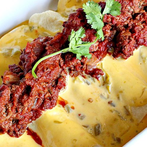 Santa Fe Enchiladas | Can't Stay Out of the Kitchen | these delicious #enchiladas have a #beef filling without beans. Then they're drenched in a cheesy #Velveeta sauce with #greenchilies & topped with more beef sauce. #Tex-Mex