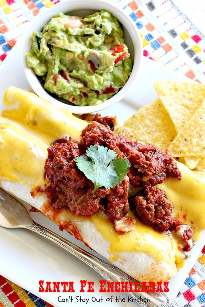 Santa Fe Enchiladas | Can't Stay Out of the Kitchen | these delicious #enchiladas have a #beef filling without beans. Then they're drenched in a cheesy #Velveeta sauce with #greenchilies & topped with more beef sauce. #Tex-Mex