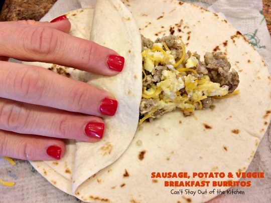 Sausage, Potato and Veggie Breakfast Burritos | Can't Stay Out of the Kitchen | these #BreakfastBurritos are fantastic. Every mouthful will have you drooling. Plus, they can be made up in advance & then popped in the microwave before heading out to work! #sausage #pork #eggs #cheese #potatoes #mushrooms #tortillas #TexMex #breakfast #HolidayBreakfast #SausagePotatoAndVeggieBreakfastBurritos
