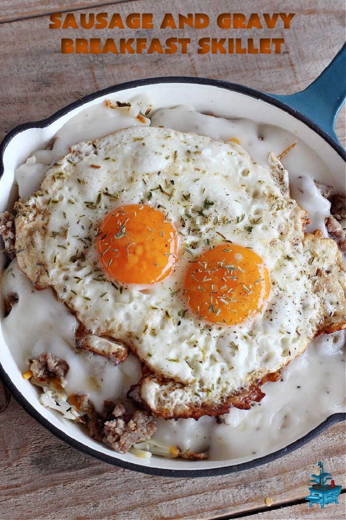 Sausage and Gravy Breakfast Skillet | Can't Stay Out of the Kitchen | this fantastic #BreakfastSkillet includes #SausageAndGravy which offers a down-home #southern #breakfast you're sure to love. This one includes #HashBrowns, both #Cheddar & #MontereyJack cheeses and sunny-side-up #eggs. Hearty, filling & so satisfying. Great for a weekend, company or #HolidayBreakfast. #holiday #FathersDay #FathersDayBreakfast #sausage #SausageAndGravyBreakfastSkillet
