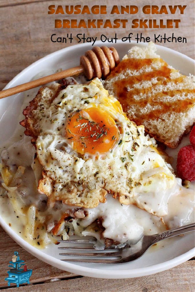Sausage and Gravy Breakfast Skillet | Can't Stay Out of the Kitchen | this fantastic #BreakfastSkillet includes #SausageAndGravy which offers a down-home #southern #breakfast you're sure to love. This one includes #HashBrowns, both #Cheddar & #MontereyJack cheeses and sunny-side-up #eggs. Hearty, filling & so satisfying. Great for a weekend, company or #HolidayBreakfast. #holiday #FathersDay #FathersDayBreakfast #sausage #SausageAndGravyBreakfastSkillet