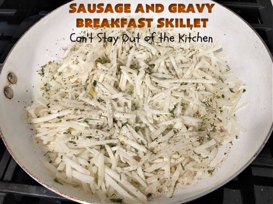 Sausage and Gravy Breakfast Skillet | Can't Stay Out of the Kitchen | this fantastic #BreakfastSkillet includes #SausageAndGravy which offers a down-home #southern #breakfast you're sure to love. This one includes #HashBrowns, both #Cheddar & #MontereyJack cheeses and sunny-side-up #eggs. Hearty, filling & so satisfying. Great for a weekend, company or #HolidayBreakfast. #holiday #FathersDay #FathersDayBreakfast #sausage #SausageAndGravyBreakfastSkillet