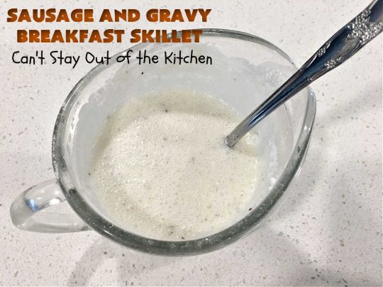 Sausage and Gravy Breakfast Skillet | Can't Stay Out of the Kitchen | this fantastic #BreakfastSkillet includes #SausageAndGravy which offers a down-home #southern #breakfast you're sure to love. This one includes #HashBrowns, both #Cheddar & #MontereyJack cheeses and sunny-side-up #eggs. Hearty, filling & so satisfying. Great for a weekend, company or #HolidayBreakfast. #holiday #FathersDay #FathersDayBreakfast #sausage #SausageAndGravyBreakfastSkillet