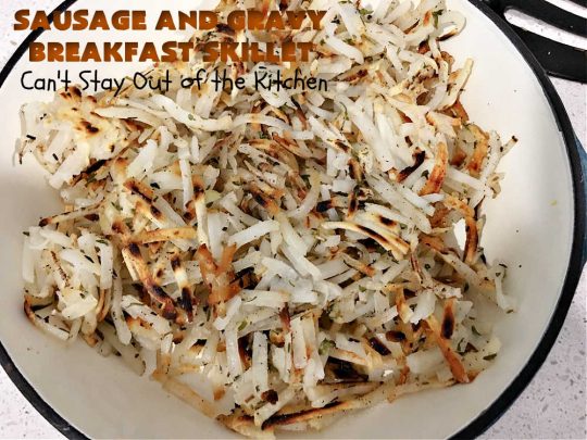Sausage and Gravy Breakfast Skillet | Can't Stay Out of the Kitchen | this fantastic #BreakfastSkillet includes #SausageAndGravy which offers a down-home #southern #breakfast you're sure to love. This one includes #HashBrowns, both #Cheddar & #MontereyJack cheeses and sunny-side-up #eggs. Hearty, filling & so satisfying. Great for a weekend, company or #HolidayBreakfast. #holiday #FathersDay #FathersDayBreakfast #sausage #SausageAndGravyBreakfastSkillet