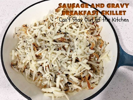 Sausage and Gravy Breakfast Skillet | Can't Stay Out of the Kitchen | this fantastic #BreakfastSkillet includes #SausageAndGravy which offers a down-home #southern #breakfast you're sure to love. This one includes #HashBrowns, both #Cheddar & #MontereyJack cheeses and sunny-side-up #eggs. Hearty, filling & so satisfying. Great for a weekend, company or #HolidayBreakfast. #holiday #FathersDay #FathersDayBreakfast #sausage #SausageAndGravyBreakfastSkillet
