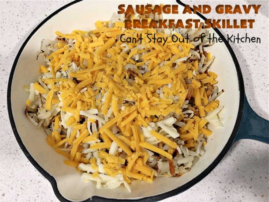 Sausage and Gravy Breakfast Skillet | Can't Stay Out of the Kitchen | this fantastic #BreakfastSkillet includes #SausageAndGravy which offers a down-home #southern #breakfast you're sure to love. This one includes #HashBrowns, both #Cheddar & #MontereyJack cheeses and sunny-side-up #eggs. Hearty, filling & so satisfying. Great for a weekend, company or #HolidayBreakfast. #holiday #FathersDay #FathersDayBreakfast #sausage #SausageAndGravyBreakfastSkillet