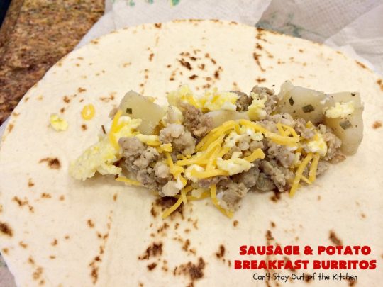 Sausage and Potato Breakfast Burritos | Can't Stay Out of the Kitchen | These fabulous #BreakfastBurritos can be made in advance. Then just microwave them before you leave for work. They include #sausage, #CheddarCheese, #eggs & seasoned #potatoes. Serve with your favorite #salsa, #PicoDeGallo or even #Guacamole! We love this amazing #TexMex #breakfast. #tortillas #SausageAndPotatoBreakfastBurritos