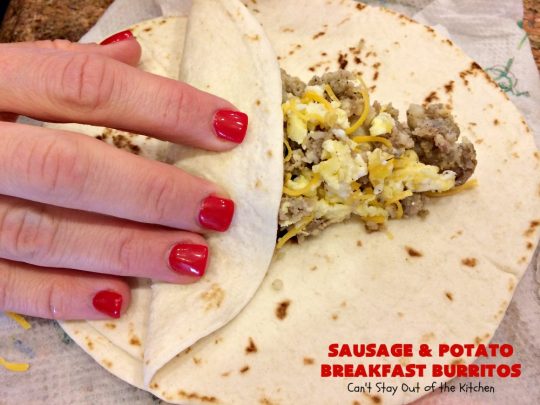 Sausage and Potato Breakfast Burritos | Can't Stay Out of the Kitchen | These fabulous #BreakfastBurritos can be made in advance. Then just microwave them before you leave for work. They include #sausage, #CheddarCheese, #eggs & seasoned #potatoes. Serve with your favorite #salsa, #PicoDeGallo or even #Guacamole! We love this amazing #TexMex #breakfast. #tortillas #SausageAndPotatoBreakfastBurritos
