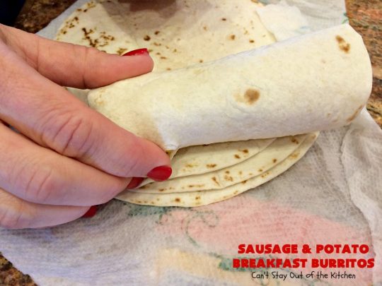 Sausage and Potato Breakfast Burritos | Can't Stay Out of the Kitchen | These fabulous #BreakfastBurritos can be made in advance. Then just microwave them before you leave for work. They include #sausage, #CheddarCheese, #eggs & seasoned #potatoes. Serve with your favorite #salsa, #PicoDeGallo or even #Guacamole! We love this amazing #TexMex #breakfast. #tortillas #SausageAndPotatoBreakfastBurritos