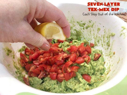 Seven Layer Tex-Mex Dip | Can't Stay Out of the Kitchen | this awesome #TexMex #dip is out of this world. It's terrific for any kind of company or #holiday party. We like it for #tailgating parties & potlucks. Also great for summer #holidays like #FourthOfJuly. #GlutenFree #Mexican #TexMexDip #LayeredMexicanDip #RefriedBeans #Jalapenos #Olives #CheddarCheese #Guacamole #TortillaChips #tomatoes #Avocados #SevenLayerTexMexDip #appetizer #TexMexAppetizer