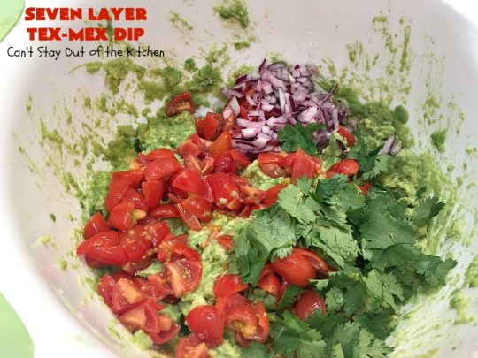 Seven Layer Tex-Mex Dip | Can't Stay Out of the Kitchen | this awesome #TexMex #dip is out of this world. It's terrific for any kind of company or #holiday party. We like it for #tailgating parties & potlucks. Also great for summer #holidays like #FourthOfJuly. #GlutenFree #Mexican #TexMexDip #LayeredMexicanDip #RefriedBeans #Jalapenos #Olives #CheddarCheese #Guacamole #TortillaChips #tomatoes #Avocados #SevenLayerTexMexDip #appetizer #TexMexAppetizer