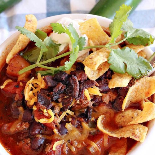 Smoky Turkey Black Bean Chili | Can't Stay Out of the Kitchen | this fantastic #chili #recipe includes #BlackBeans, #FireRoastedTomatoes, #bacon, #turkey, #cilantro #jalapeno & #ChipotlePeppers & wonderful seasonings that provide mouthwatering flavor. You can make this mild or spicy hot--whatever you desire. Great for #tailgating parties & potlucks. #BlackBeanChili #TurkeyChili #SmokyTurkeyBlackBeanChili #Fritos #CheddarCheese #ChiliWithBacon