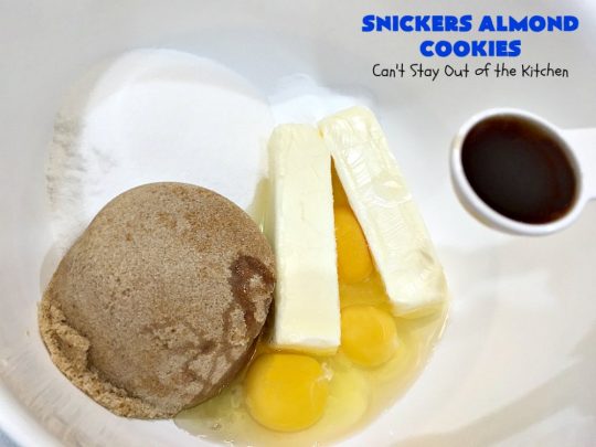 Snickers Almond Cookies | Can't Stay Out of the Kitchen | these scrumptious #cookies will cure any sweet tooth craving. This #dessert uses #SnickersAlmondBars in the dough. So they're filled with #chocolate & #almonds. Every bite will have you salivating. #tailgating #holiday #baking #HolidayBaking #HolidayDessert #SnickersDessert #ChocolateDessert #AlmondDessert #ChristmasCookieExchange #Snickers #SnickersBars #SnickersAlmondCookies