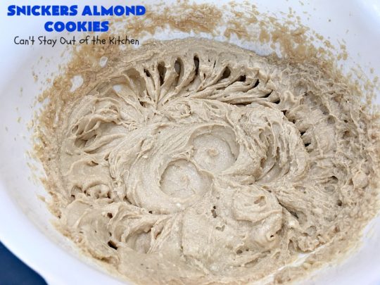 Snickers Almond Cookies | Can't Stay Out of the Kitchen | these scrumptious #cookies will cure any sweet tooth craving. This #dessert uses #SnickersAlmondBars in the dough. So they're filled with #chocolate & #almonds. Every bite will have you salivating. #tailgating #holiday #baking #HolidayBaking #HolidayDessert #SnickersDessert #ChocolateDessert #AlmondDessert #ChristmasCookieExchange #Snickers #SnickersBars #SnickersAlmondCookies