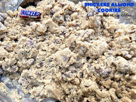 Snickers Almond Cookies | Can't Stay Out of the Kitchen | these scrumptious #cookies will cure any sweet tooth craving. This #dessert uses #SnickersAlmondBars in the dough. So they're filled with #chocolate & #almonds. Every bite will have you salivating. #tailgating #holiday #baking #HolidayBaking #HolidayDessert #SnickersDessert #ChocolateDessert #AlmondDessert #ChristmasCookieExchange #Snickers #SnickersBars #SnickersAlmondCookies