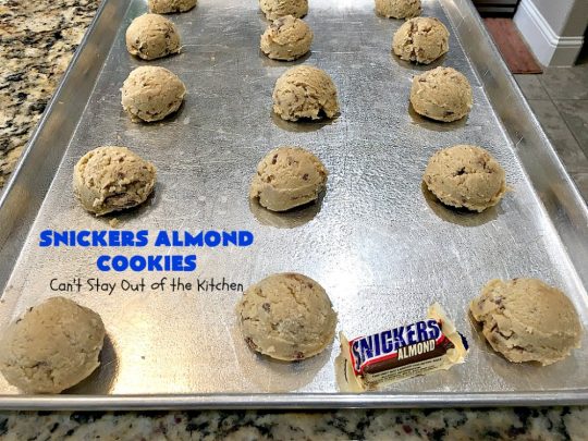 Snickers Almond Cookies | Can't Stay Out of the Kitchen | these scrumptious #cookies will cure any sweet tooth craving. This #dessert uses #SnickersAlmondBars in the dough. So they're filled with #chocolate & #almonds. Every bite will have you salivating. #tailgating #holiday #baking #HolidayBaking #HolidayDessert #SnickersDessert #ChocolateDessert #AlmondDessert #ChristmasCookieExchange #Snickers #SnickersBars #SnickersAlmondCookies