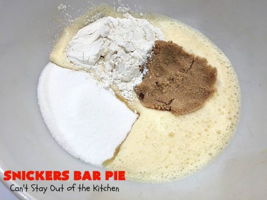Snickers Bar Pie | Can't Stay Out of the Kitchen | this outrageously irresistible #pie is filled with #SnickersBars. Every bite contains #chocolate, #caramel & #peanuts. Fantastic for special occasions & #holidays like #ValentinesDay. #CaramelDessert #ChocolateDessert #HolidayDessert #PeanutButterDessert #SnickersDessert #SnickersCandyBars #SnickersBarPie #dessert