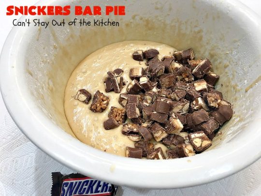 Snickers Bar Pie | Can't Stay Out of the Kitchen | this outrageously irresistible #pie is filled with #SnickersBars. Every bite contains #chocolate, #caramel & #peanuts. Fantastic for special occasions & #holidays like #ValentinesDay. #CaramelDessert #ChocolateDessert #HolidayDessert #PeanutButterDessert #SnickersDessert #SnickersCandyBars #SnickersBarPie #dessert