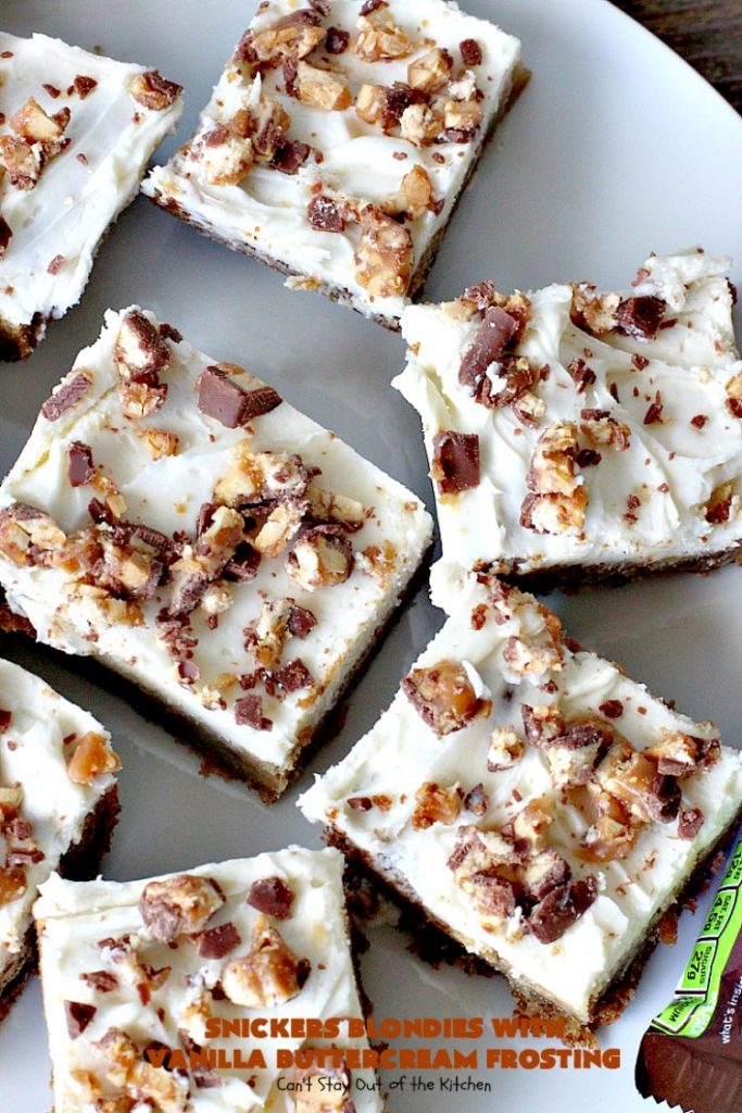 Snickers Blondies with Vanilla Buttercream Frosting | Can't Stay Out of the Kitchen | these outrageous #brownies are divine! The frosting is oh, so heavenly. One bite and you'll be drooling! #dessert #snickers #chocolate