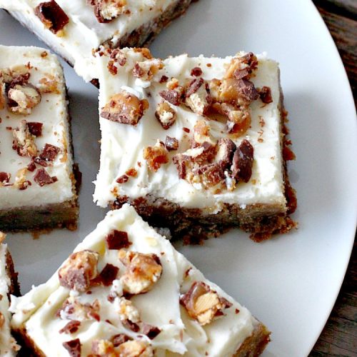 Snickers Blondies with Vanilla Buttercream Frosting | Can't Stay Out of the Kitchen | these outrageous #brownies are divine! The frosting is oh, so heavenly. One bite and you'll be drooling! #dessert #snickers #chocolate