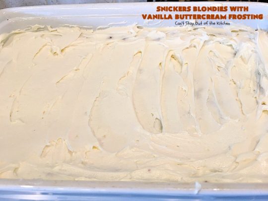 Snickers Blondies with Vanilla Buttercream Frosting | Can't Stay Out of the Kitchen | these outrageous #brownies are divine! The frosting is oh, so heavenly. One bite and you'll be drooling! #dessert #snickers #chocolate