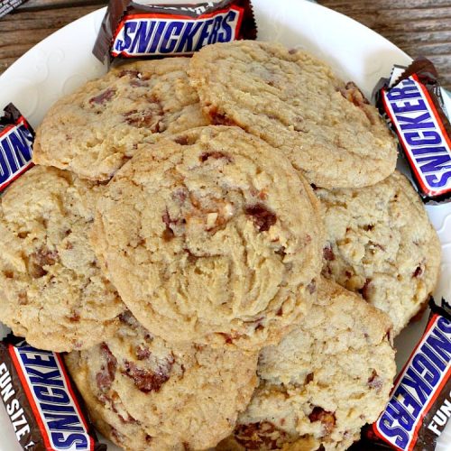 Snickers Cookies | Can't Stay Out of the Kitchen | these #cookies are so irresistible. They're made with original #SnickersBars so they're filled with #chocolate, #caramel & #peanuts. Every bite will have you drooling. Great for potlucks, #tailgating parties or any special occasion. #dessert #holiday #Snickers #HolidayDessert #ChristmasCookieExchange #ChocolateDessert #CaramelDessert #PeanutDessert #SnickersDessert #SnickersCookies