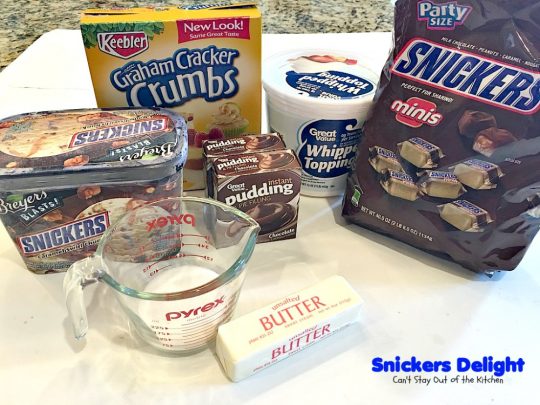 Snickers Delight | Can't Stay Out of the Kitchen | fantastic #icecream #dessert with a graham cracker crust, a #snickers ice cream & #chocolate pudding layer & topped with chopped Snickers bars. This will become your favorite dessert!