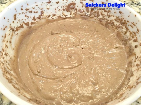 Snickers Delight | Can't Stay Out of the Kitchen | fantastic #icecream #dessert with a graham cracker crust, a #snickers ice cream & #chocolate pudding layer & topped with chopped Snickers bars. This will become your favorite dessert!