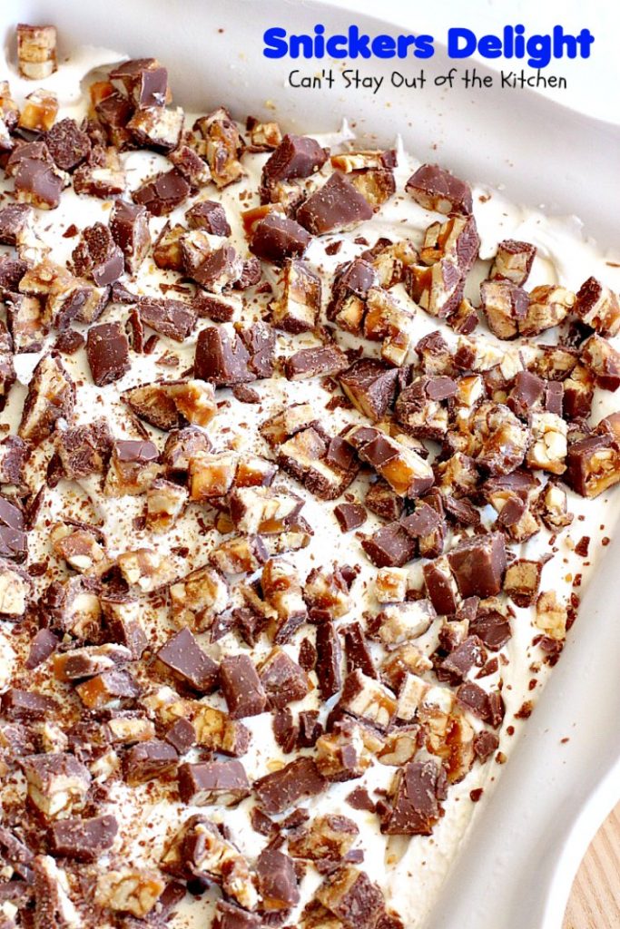 Snickers Delight | Can't Stay Out of the Kitchen | fantastic #icecream #dessert with a graham cracker crust, a #snickers ice cream & #chocolate pudding layer & topped with chopped Snickers bars. This will become your favorite dessert!