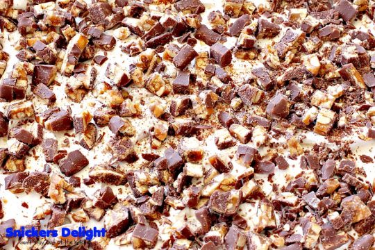 Snickers Delight | Can't Stay Out of the Kitchen | fantastic #icecream #dessert with a graham cracker crust, a #snickers ice cream & #chocolate pudding layer & topped with chopped Snickers bars. This will become your favorite dessert!